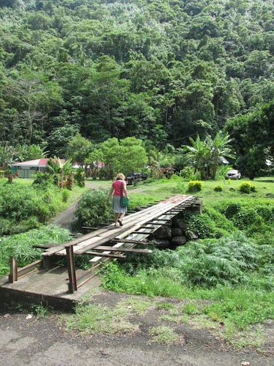 Sister Morgan Taylor crosses a bridge while proselytizing during her mission to Tahiti.