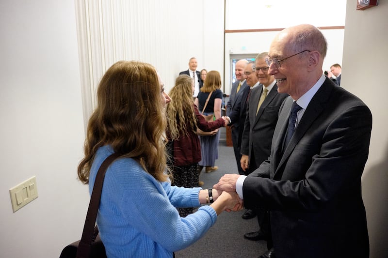 President Henry B. Eyring, Elder Gary E. Stevenson, Elder Hugo Montoya and Elder Matthew Harding greet sister missionaries during a meeting Nov. 16, 2019, with the North Carolina Charlotte Mission.