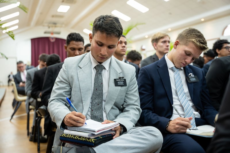 Missionaries take notes while attending a devotional with Elder Ronald A. Rasband of the Quorum of the Twelve Apostles in Managua, Nicaragua, on Friday, 16, 2026.