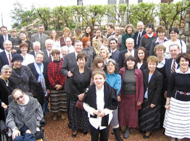 Those attending building's dedication, including Elder Cecil O. Samuelson and his wife, Sharon, Elde
