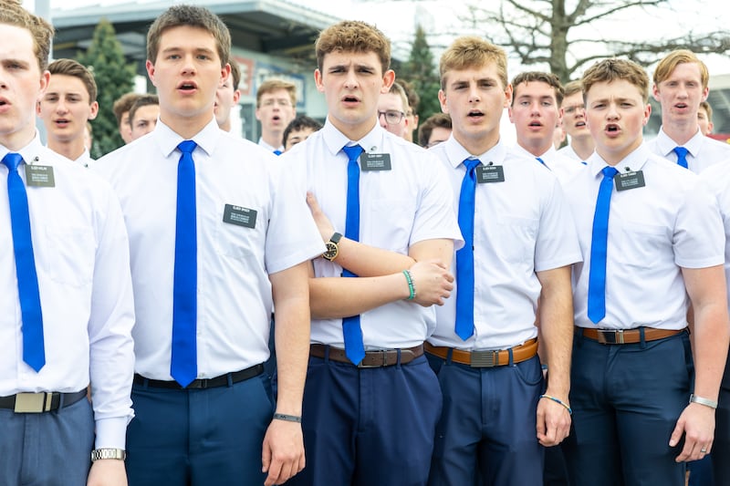 Missionaries in the Missouri Independence Mission warm up before singing the national anthem at the Kansas City Royals game, Thursday, April 9, 2026.