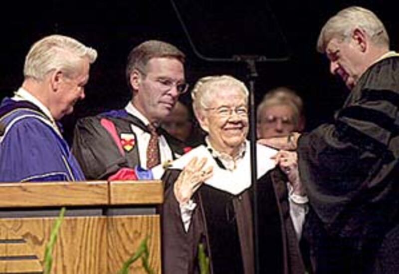 Lucile C. Tate receives honorary doctorate from BYU leaders.
