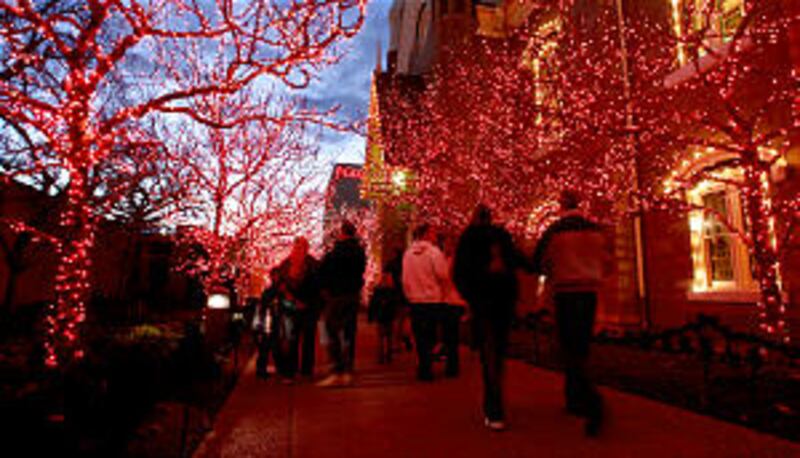 Visitors gets their first look at the lights on Temple Square after they were turned on as part of a