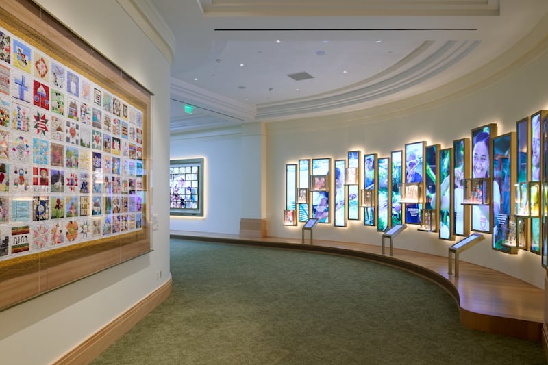 Walls on the lower level of the Temple Square Visitors’ Center in Salt Lake City contain video, photos, audio and "The Family Quilt." Doors opened to the public on May 18, 2026.