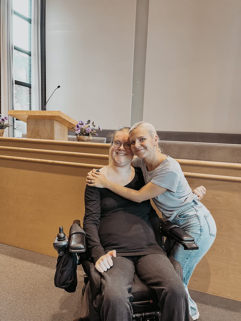 Eirin Cecilie Gjedrem smiles as her friend Gabriella Geddes gives her a hug.