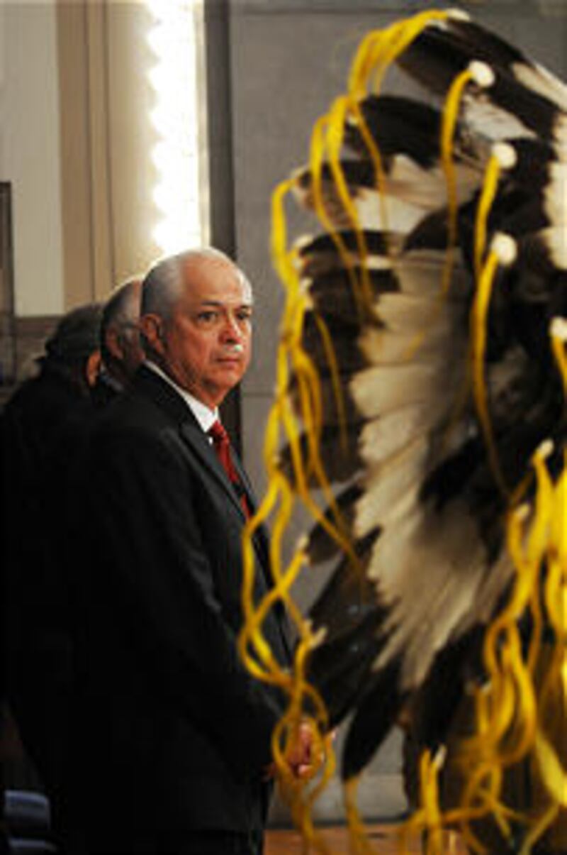 Larry EchoHawk watches during his ceremonial swearing-in as Lee Juan Tyler of the Shoshone-Bannock T