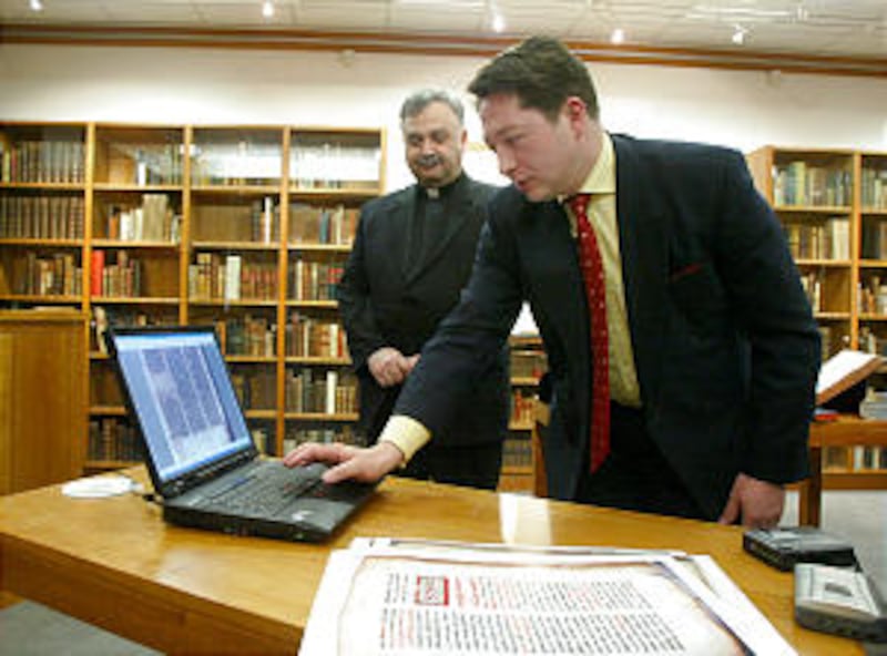 Kristian Heal of BYU demonstrates the DVD of ancient Syriac Christian documents digitized at the Vat