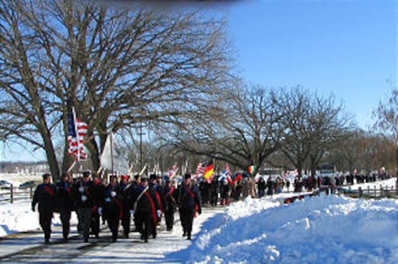 Re-enactors trek down Parley Street, the "Trail of Hope" in Historic Nauvoo, commemorating the Feb.