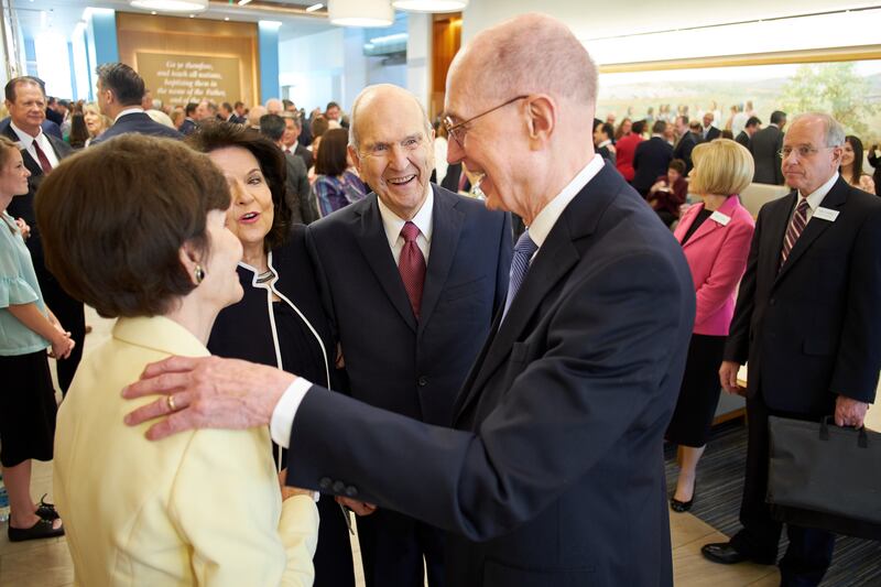 President Henry B. Eyring speaks with Sister Kristen Oaks, Sister Wendy Nelson and President Russell