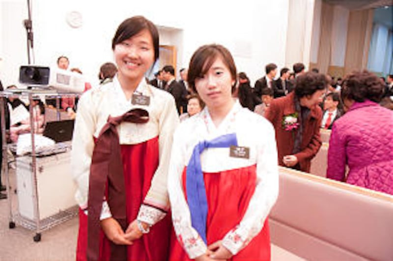 Sister NaRea Lee and Sister UnBeul Oh, LDS missionaries in Seoul, dressed in traditional Korean Hanb