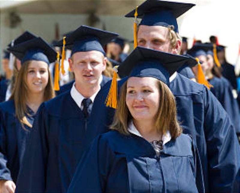 BYU Graduates walk in line during commencement exercises on August 9, 2012 in the Marriott Center on