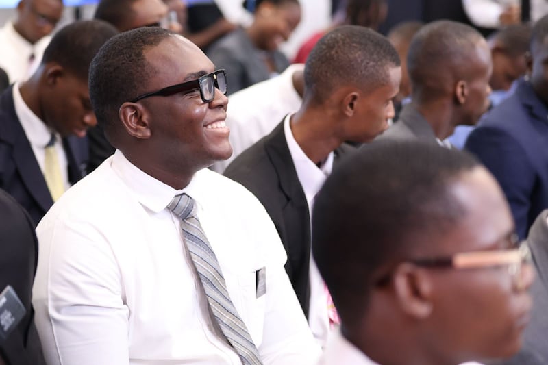 A missionary smiles as he listens to instruction from Elder Ronald A. Rasband of the Quorum of the Twelve Apostles and other Church leaders during a meeting in the border city of Dajabón, Dominican Republic, on Sept. 11, 2026.