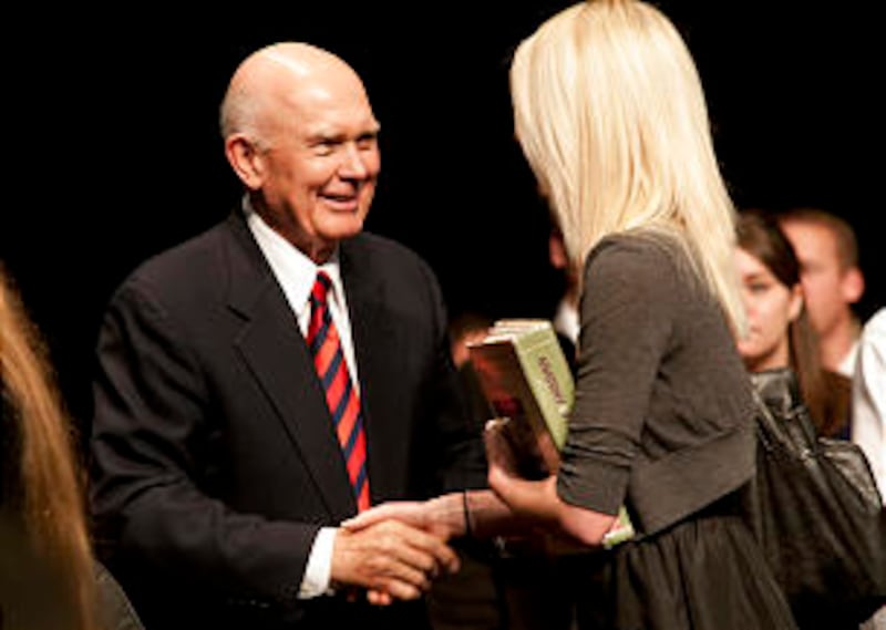 Students line up following the devotional to express appreciation to Elder Dallin H. Oaks.