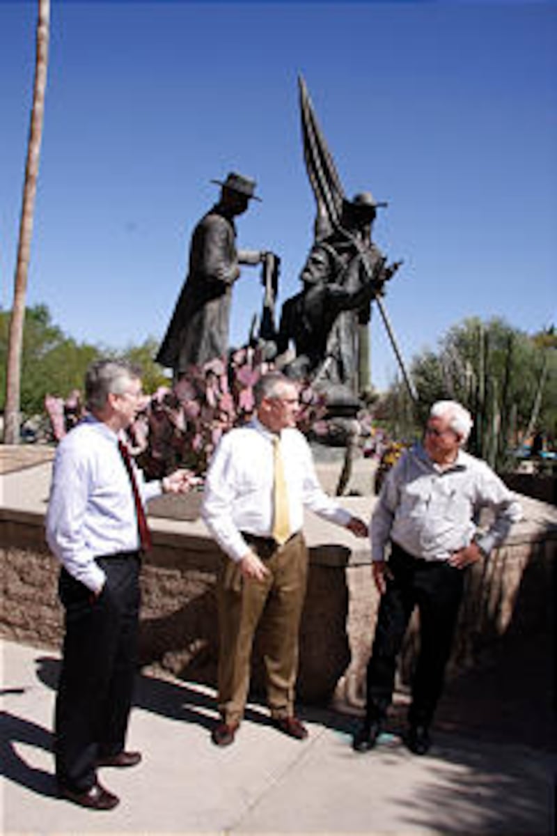 David Hoefferle, Pres. Gary D. Rasmussen, Duane Bingham stand near Mormon Battalion Monument.