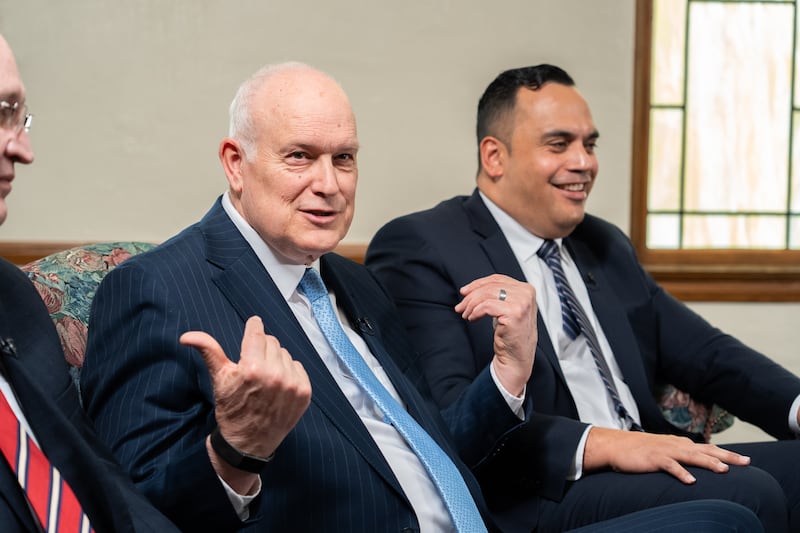 President Paul V. Johnson points to his counselors seated on either side of him during the filming of the Church News podcast episode airing Tuesday, March 31, 2026.