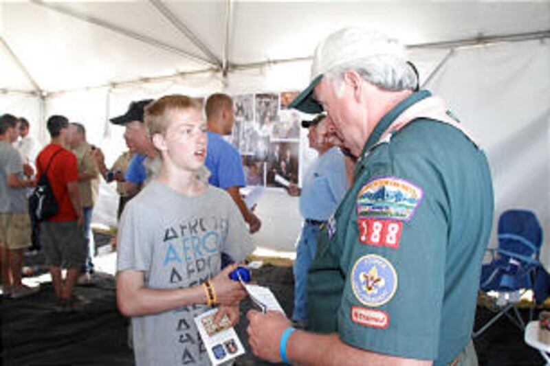 A Scout works on the requirements to receive the Thomas S. Monson award.