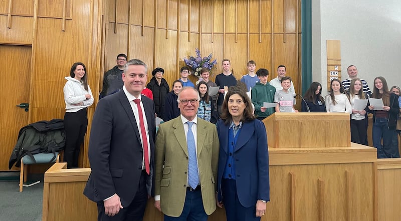 James Saunders Watson, the lord lieutenant of Northamptonshire; stands with his wife and the youth of the Northampton England Stake in the chapel in March 2025.
