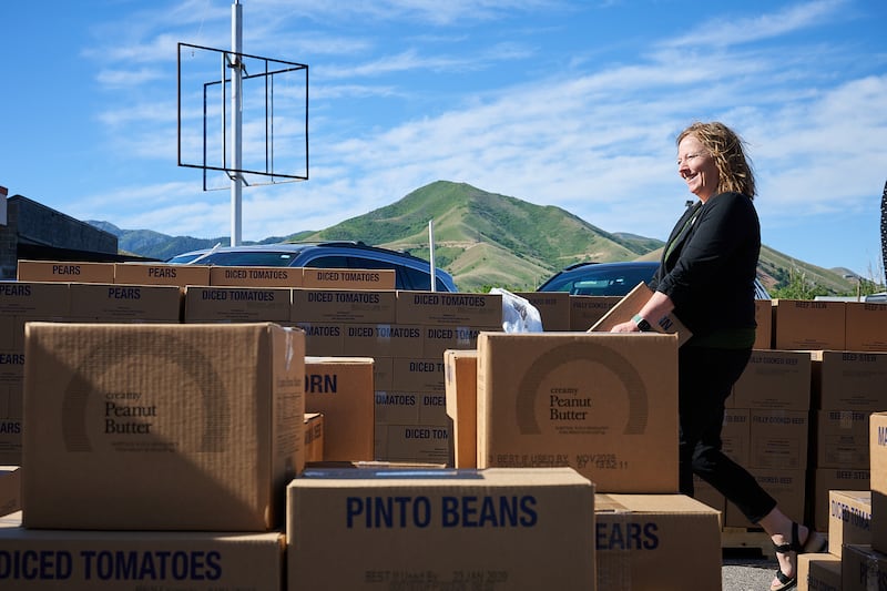 Tooele Mayor Maresa Manzione helps unload the donation from The Church of Jesus Christ of Latter-day Saints to Switchpoint in Tooele, Utah, on Thursday, May 28, 2026.