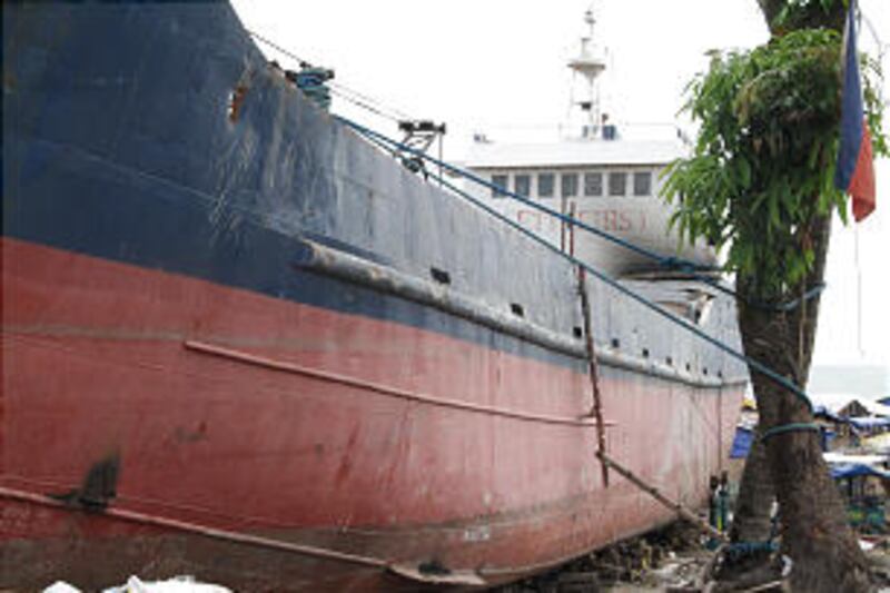 During Typhoon Haiyan this large boat was carried inland in Tacloban, Philippines. More than 100 day