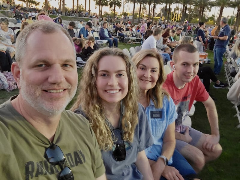Sister Kim Ward, second from right, smiles for a photo with her family at an Easter pageant on the front lawn of the Mesa Arizona Temple, April 2025.