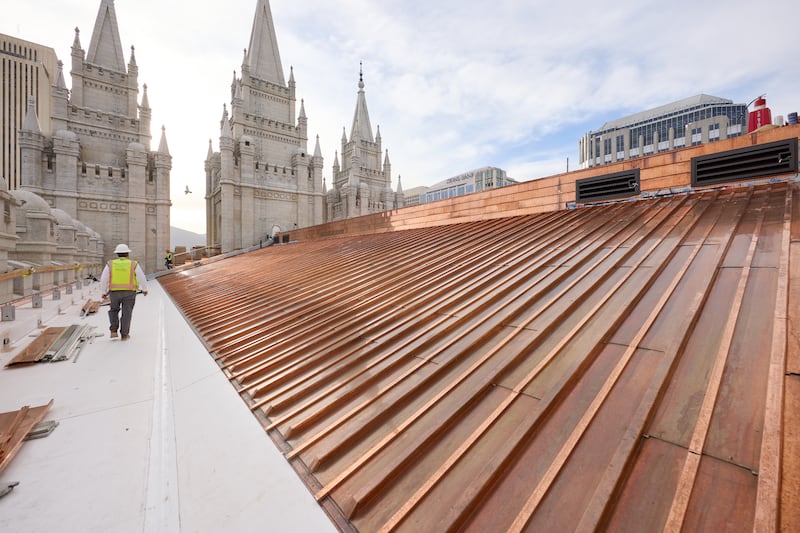 Crews install a new copper roof on the Salt Lake Temple on Tuesday, April 21, 2026, in Salt Lake City.