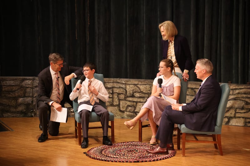 President Steven J. Lund, President Bonnie H. Cordon and Elder Jeremiah J. Morgan speak with youth during a training meeting in the Nauvoo Visitors’ Center in Nauvoo, Illinois, Sept. 24