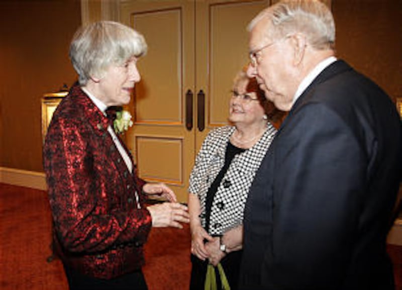 Pamela Atkinson talks with Elder M. Russell Ballard and wife Geraldine in Salt Lake City Thursday,
