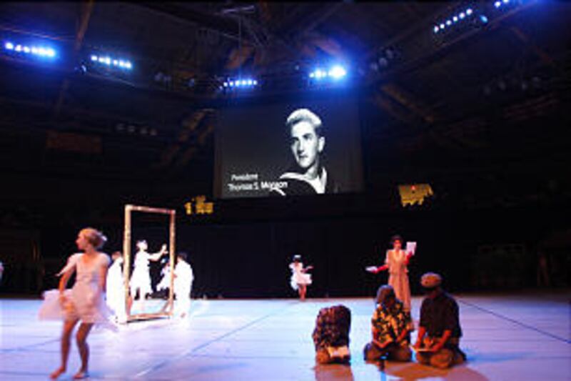 A photo of Church President Thomas S. Monson is shown on a screen during a segment of a Laie Hawaii