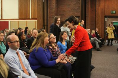 Sister Kristin Oaks greets members before a Holladay Region Mid-Single Adult Fireside on Jan. 13, 2019.