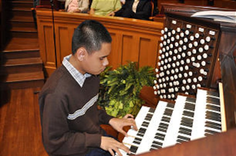 Kuha'o Kawaauhau-Case, 15, blind since birth, applies his talent for playing by ear on the organ in