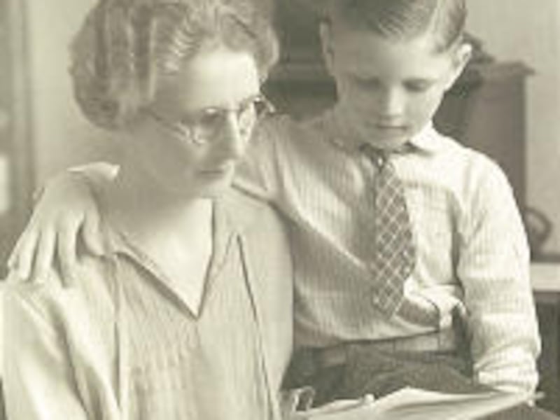Wayne Quinton sits with his mother, Ada Moore Quinton, who encouraged him to pursue an education.