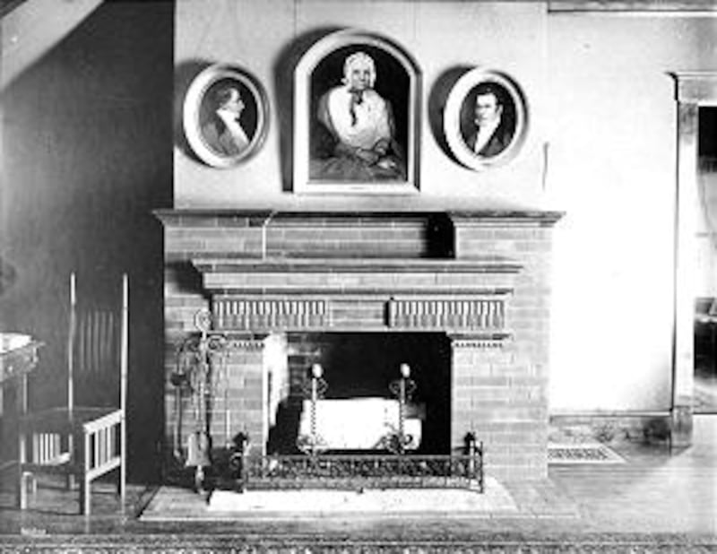 Pictures of Lucy Mack, Hyrum and Joseph Smith hang over fireplace in memorial cottage.