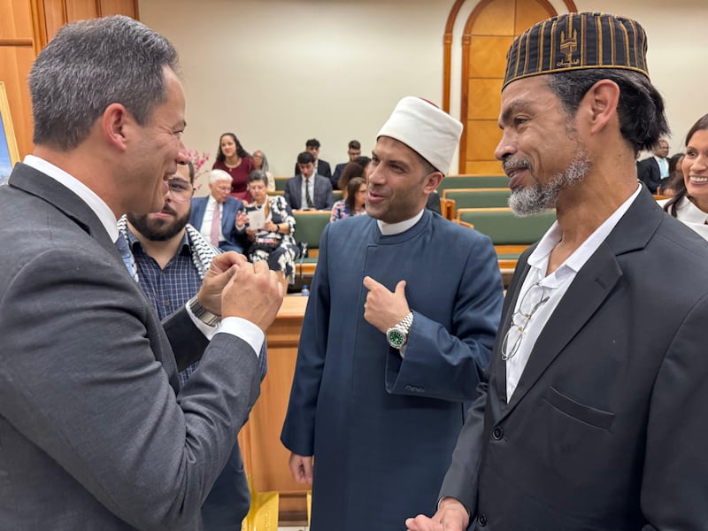 Elder Ronald M. Barcellos, a General Authority Seventy and counselor in the Brazil Area presidency, left, talks with attendees at the groundbreaking ceremony for the Santos Brazil Temple on Saturday, Aug. 1, 2026, in Santos, Brazil.