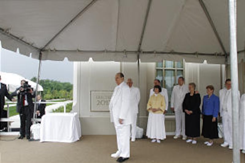 President Thomas S. Monson and others listen to a choir during the cornerstone ceremony at the Kansas City Missouri Temple dedication.