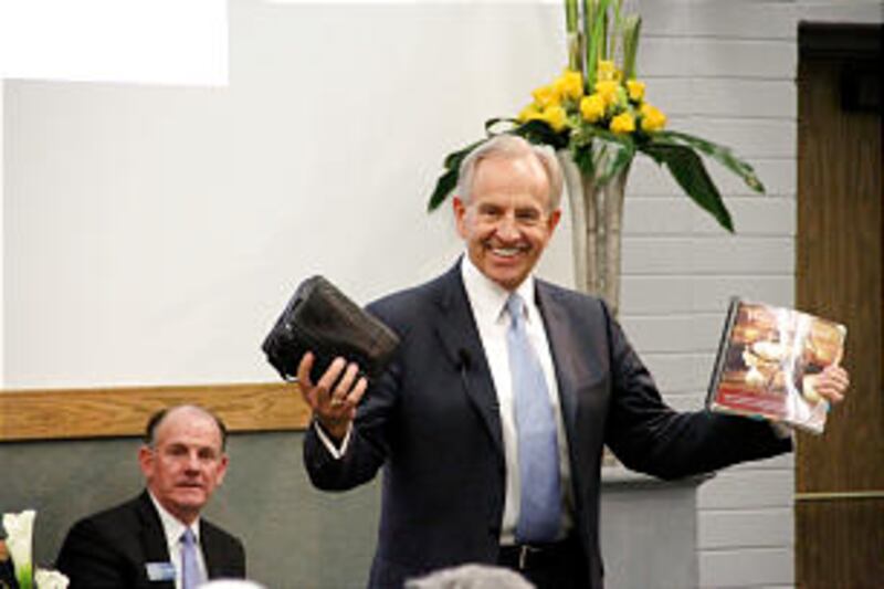 Elder W. Craig Zwick displays what he says are the tools that should be used in teaching missionarie
