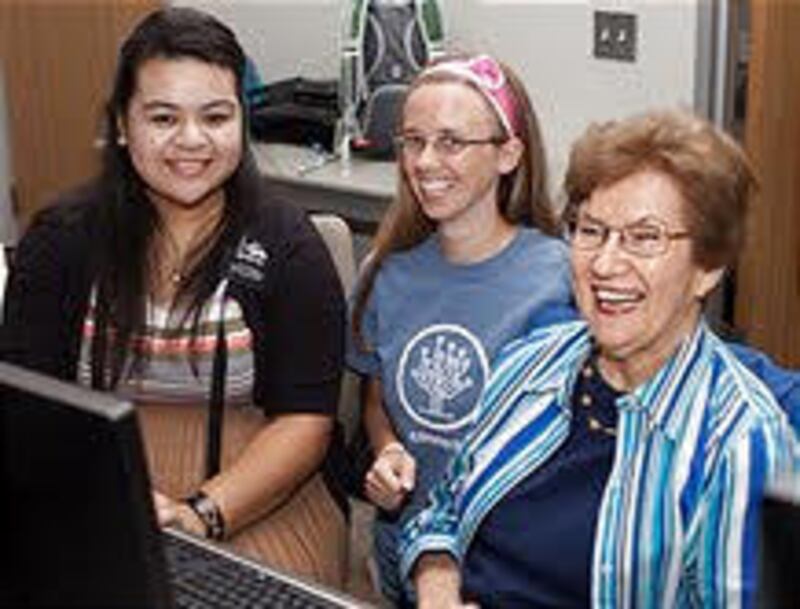Sister Finau Tokilupe Vea, Houston Texas South Mission, left, and local member Judie Rawlin assist S