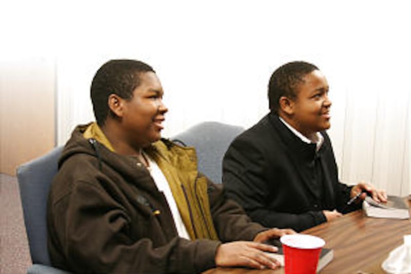 Friends Reggie Radford, left, and Tahir Edwards keep each other company in the early morning seminar