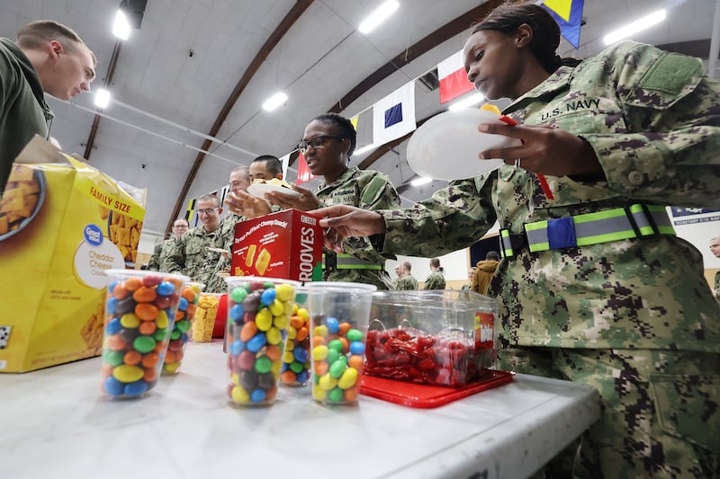 U.S. Naval officer candidates line up for treats after the Sailors’ Devotional.