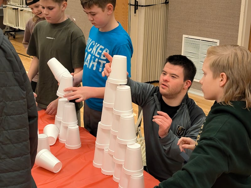 Disability activity program participants do a cup stacking game in Las Vegas, Nevada, in January 2026.