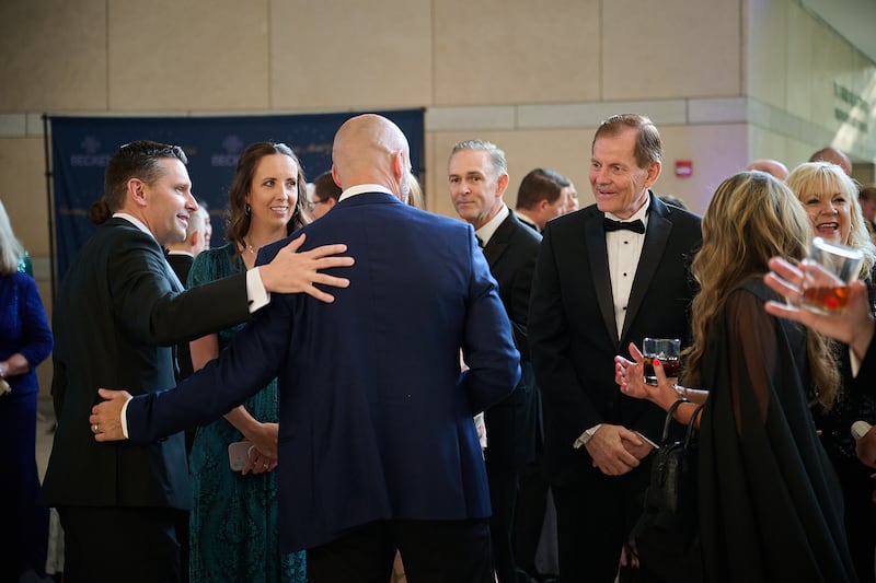 Elder Gary E. Stevenson of the Quorum of the Twelve Apostles, right, greets guests at Becket's annual Canterbury Medal Gala at the National Constitution Center in Philadelphia on Thursday, June 11, 2026. Also present is Elder Alexander Dushku, General Authority Seventy, middle, and Derrick Porter, far left, producer, principal writer and presenter of The Tabernacle at Temple Square.