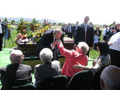 President Thomas S. Monson greets Sister Gwen B. Goaslind during the graveside service for her husband, Elder Jack H. Goaslind Jr., on May 2, 2011.
