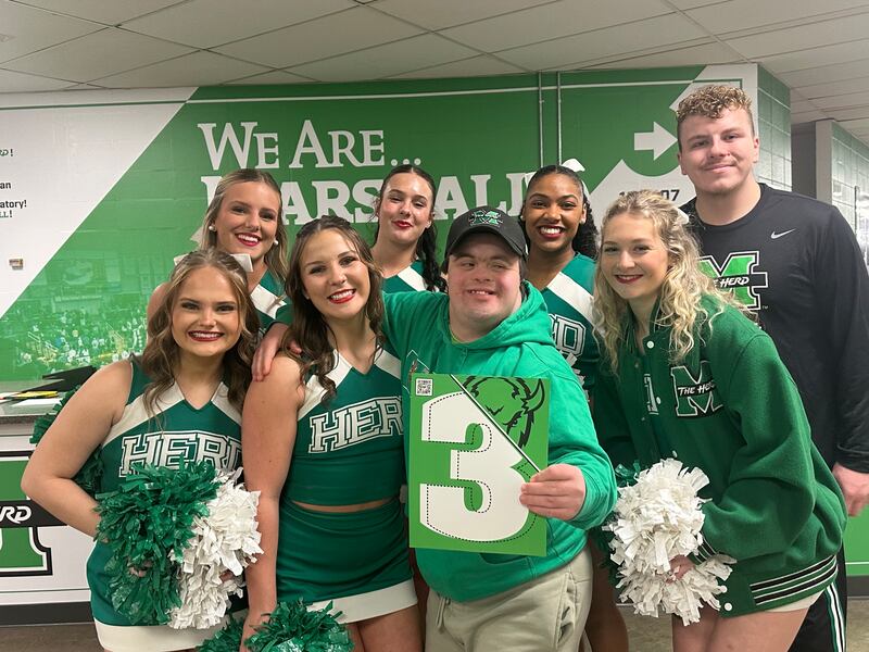 Elder Welch smiles with a group of cheerleaders on_______ in Huntington, West Virginia.