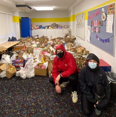 Benjamin and Sophia Higbee, members of the McLean Virginia Stake help gather food for the drive-thru Nativity and food drive hosted by the McLean stake on Dec. 11 an 12, 2020.