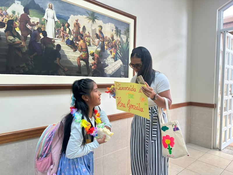 A family member welcomes a Primary child back from her mock mission after the Samborondón Ecuador Stake Primary's mini missionary training center activity in Guayaquil, Ecuador, Feb. 21, 2026.