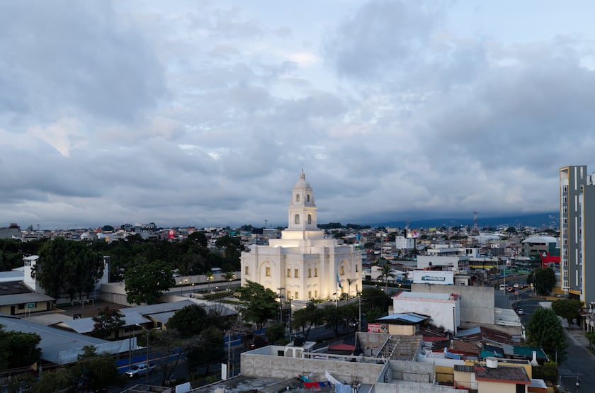 The Miraflores Guatemala City Guatemala Temple illuminated on a cloudy day.
