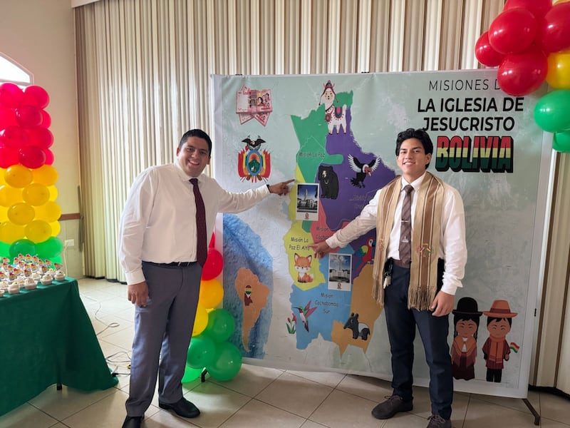 José Rodas and Pedro Aspiazu, who both served missions in Bolivia, point to their mission on a map of the country during the Samborondón Ecuador Stake Primary's mini missionary training center activity in Guayaquil, Ecuador, Feb. 21, 2026.
