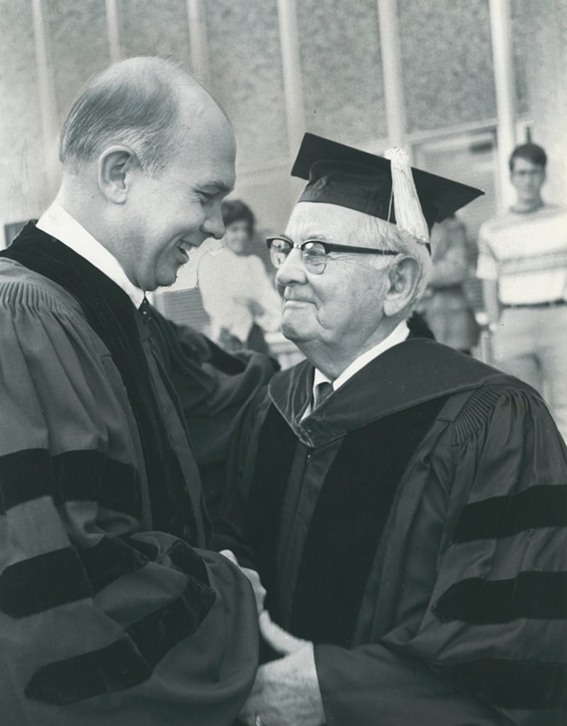BYU President Dallin Oaks, left, gets handshake and hug from Church President Spencer W. Kimball.