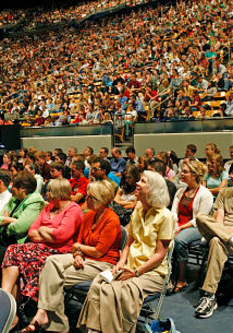 Crowd listens as President Cecil O. and Sister Sharon G. Samuelson speak at the opening campus devot