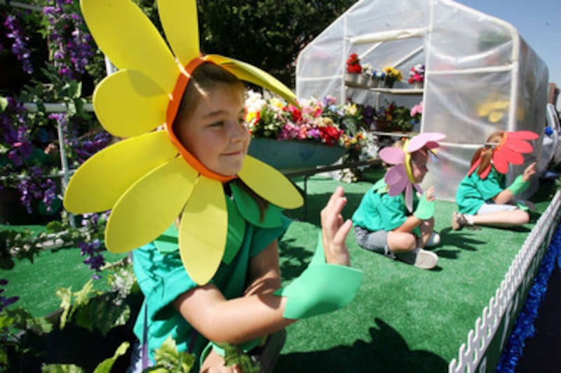 Sierra Lukens of the Bennion Utah Stake rides on the stakes' float during the Days of '47 youth par