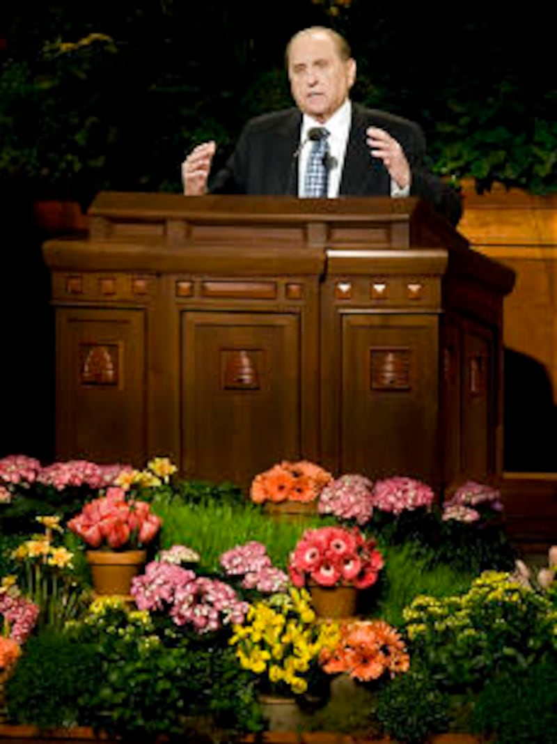 President Thomas S. Monson speaks to the young women during the meeting. Thousands of young women at